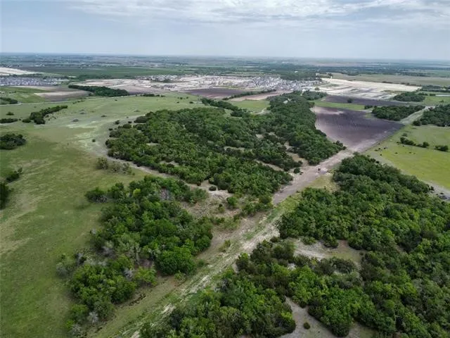 an aerial view of a yard with a lake view