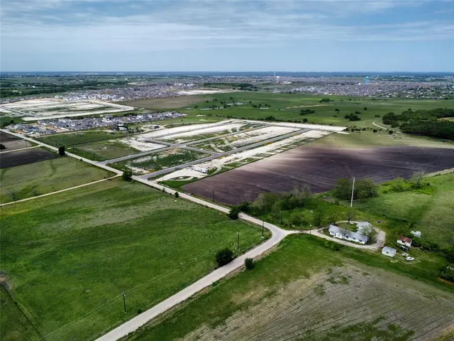 a view of a field with an outdoor space