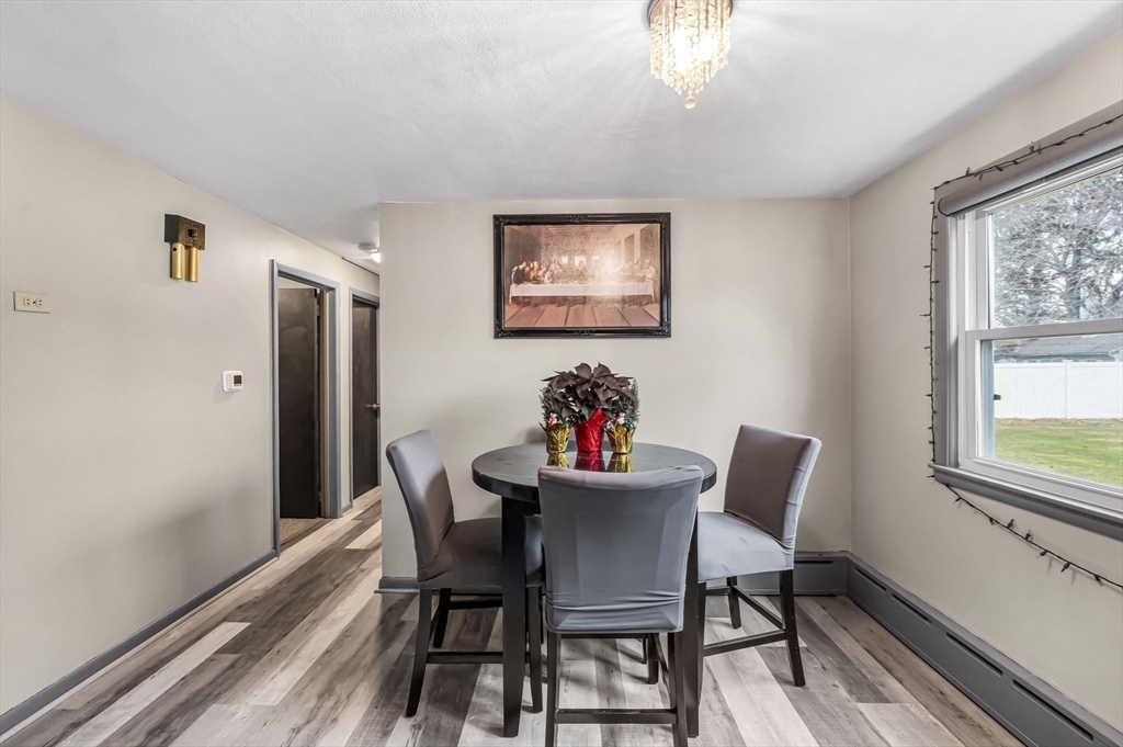 31 Stone Path Lane West Springfield, MA 01089 - Photo 11 of 31 a view of a dining room with furniture a chandelier and wooden floor