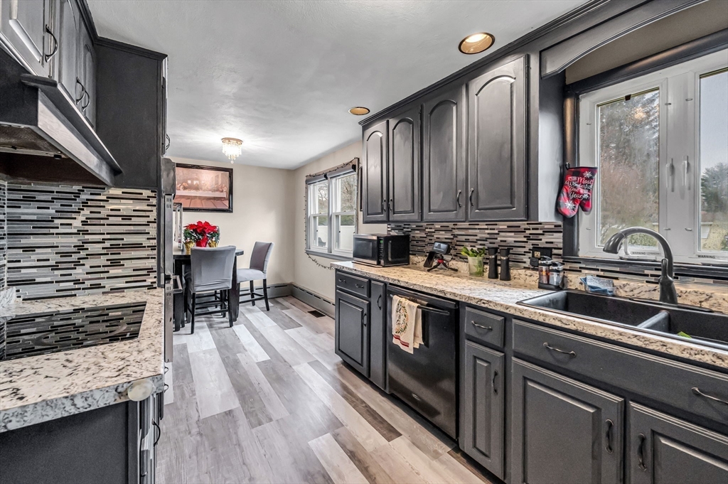 31 Stone Path Lane West Springfield, MA 01089 - Photo 14 of 31 a kitchen with stainless steel appliances granite countertop a sink stove and cabinets