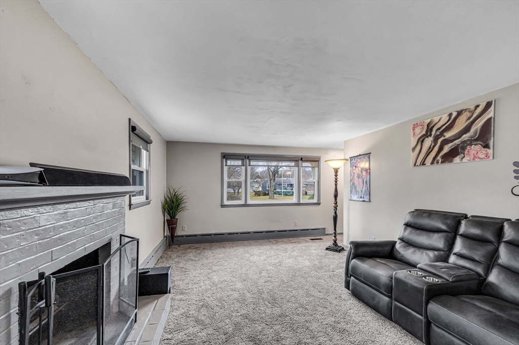 31 Stone Path Lane West Springfield, MA 01089 - Photo 7 of 31 a living room with furniture and a fireplace