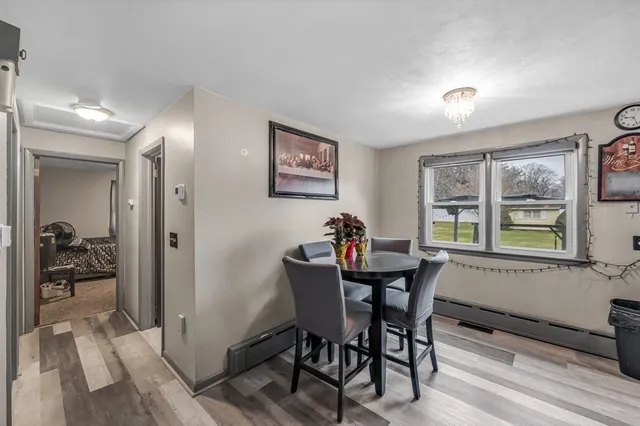 a view of a dining room with furniture and a window