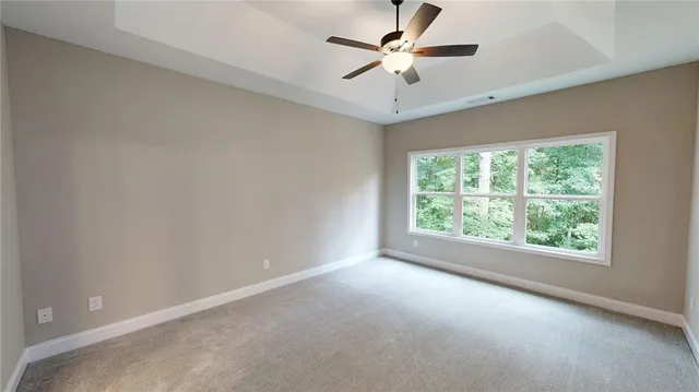 a bathroom with a tub and a window