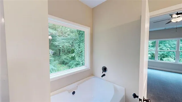 a bathroom with a glass shower door