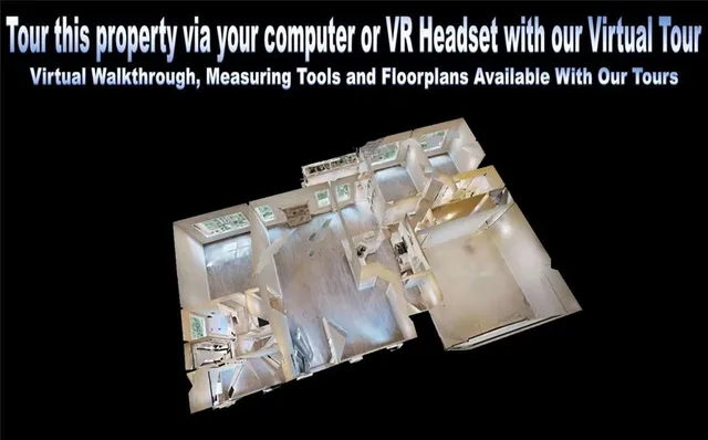 a view of a house with a yard and furniture