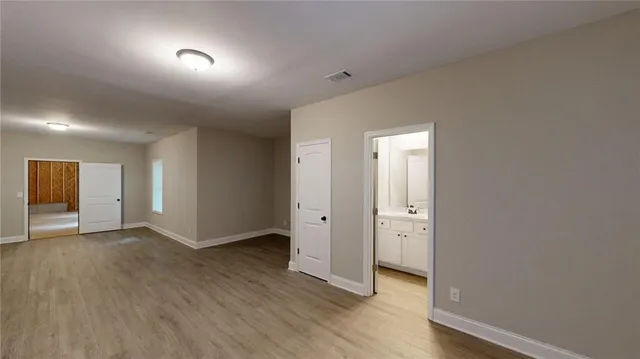 a bathroom with a sink toilet and mirror