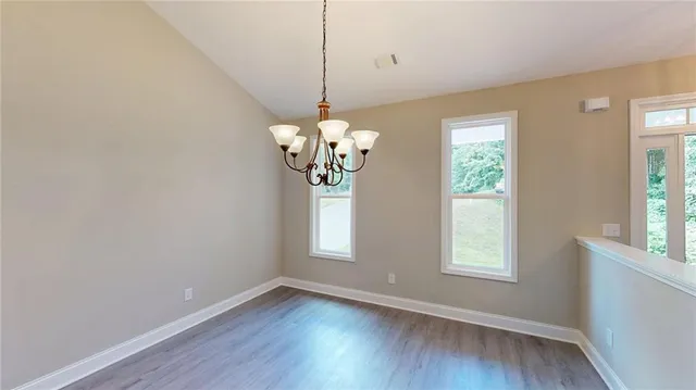 a kitchen with a sink stove and microwave