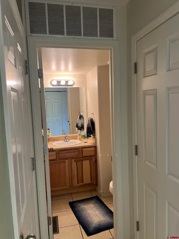 a view of living room with granite countertop furniture and a fireplace