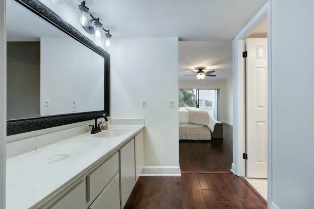 a en suite bathroom with a sink and mirror