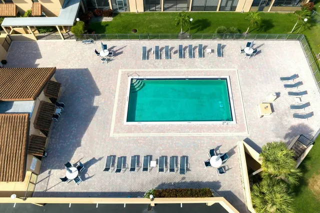 a view of swimming pool with a yard