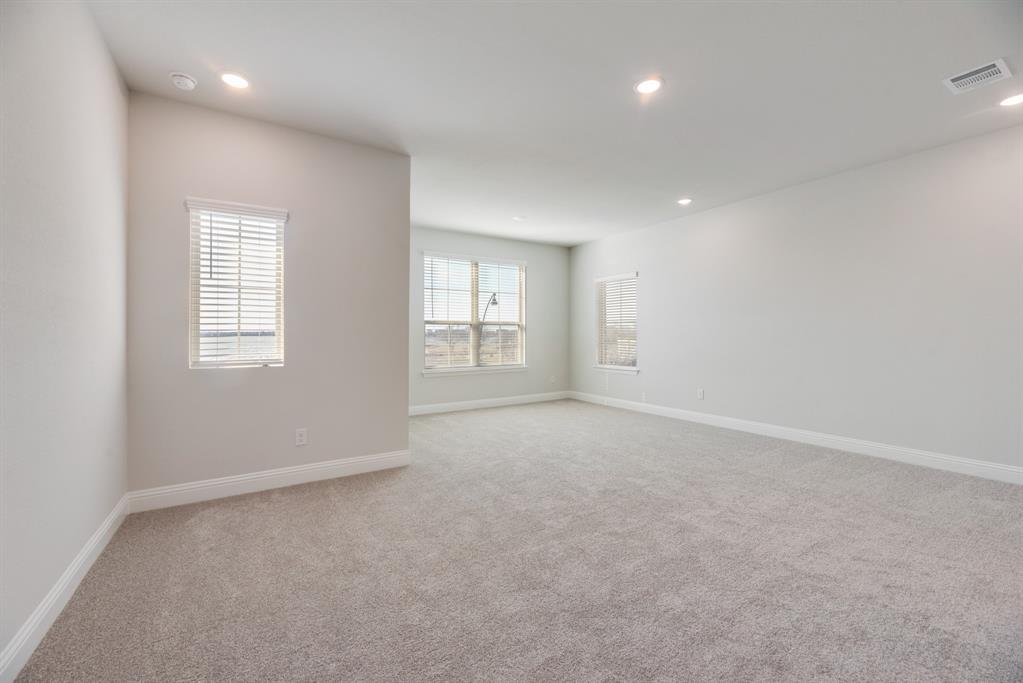 7009 Sunset Boulevard Rowlett, TX 75088 - Photo 19 of 35 an empty room with windows and closet