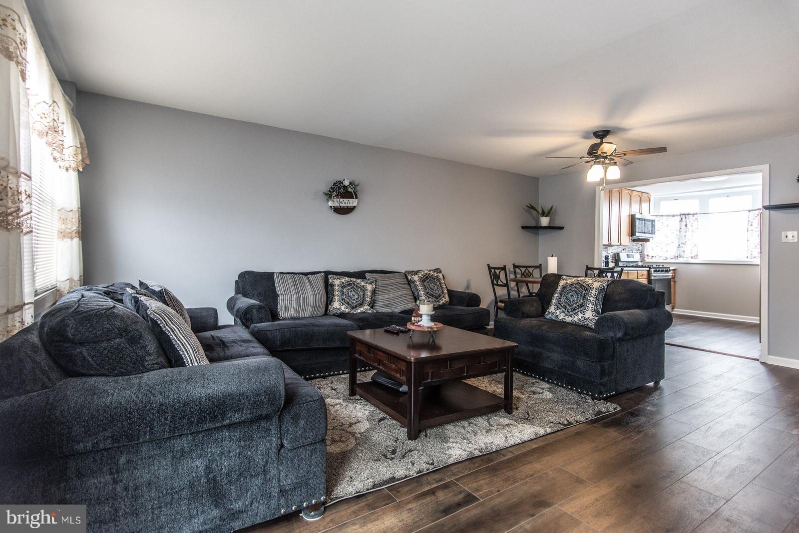 12138 Barbary Road Philadelphia, PA 19154 - Photo 13 of 71 a living room with furniture ceiling fan and a window
