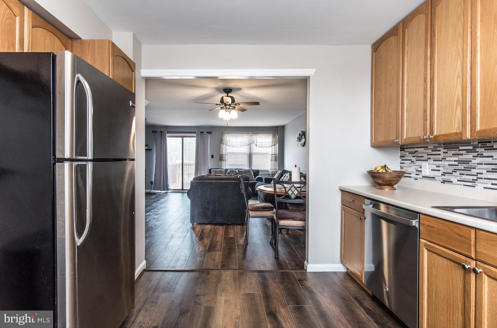 12138 Barbary Road Philadelphia, PA 19154 - Photo 21 of 71 a kitchen with stainless steel appliances granite countertop a refrigerator stove and sink