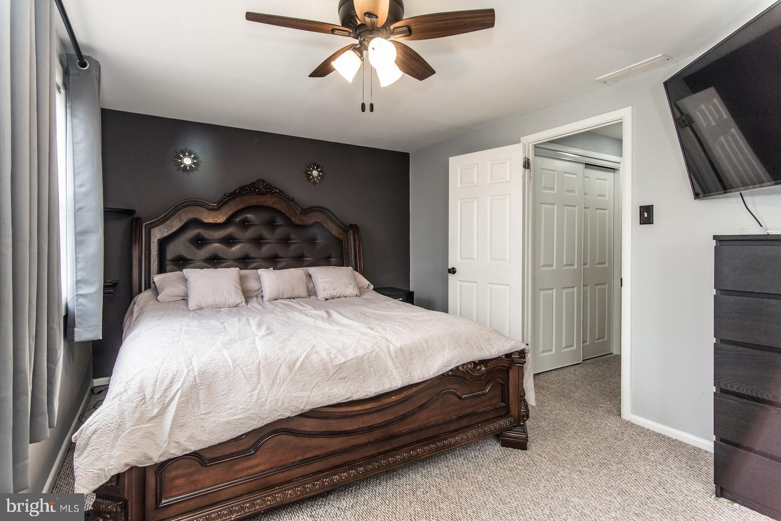 12138 Barbary Road Philadelphia, PA 19154 - Photo 27 of 71 a bedroom with a bed and a chandelier