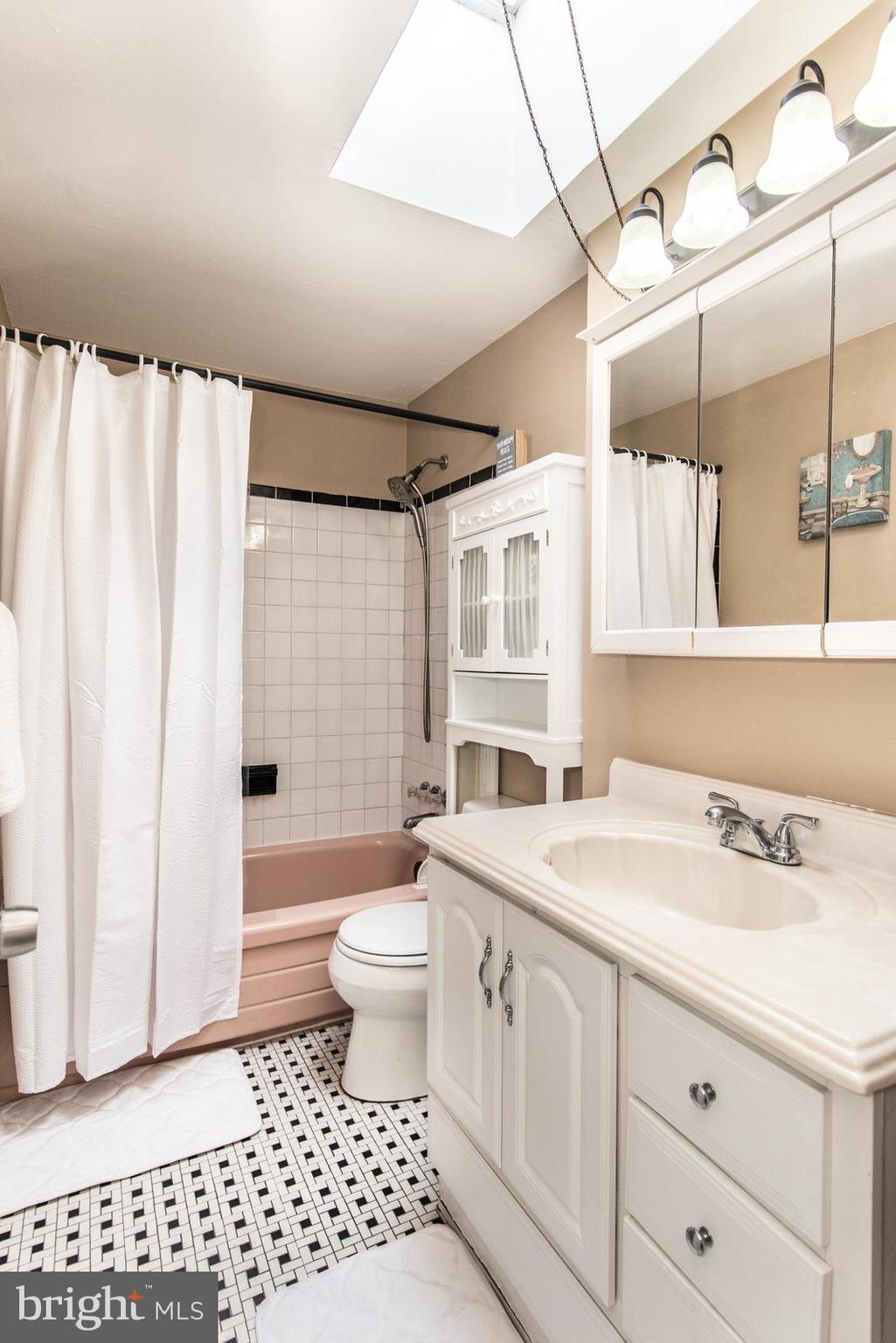 12138 Barbary Road Philadelphia, PA 19154 - Photo 30 of 71 a bathroom with a sink a toilet a mirror a vanity and shower