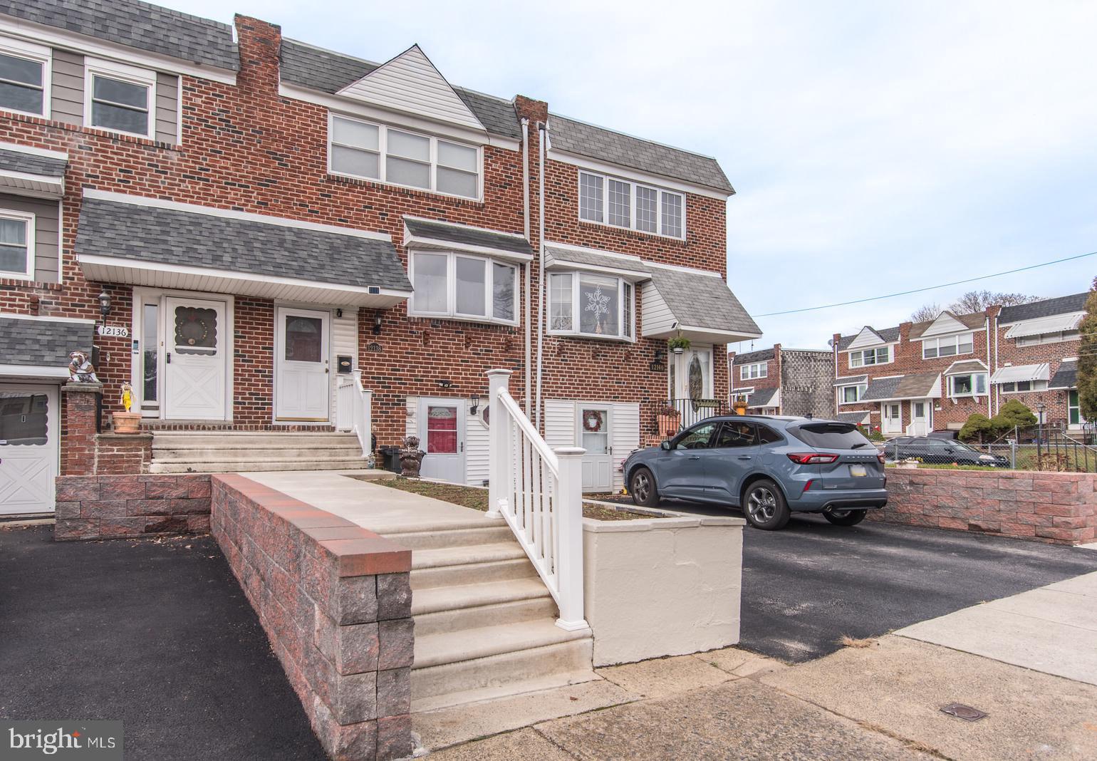 12138 Barbary Road Philadelphia, PA 19154 - Photo 3 of 71 a view of a brick building with many windows