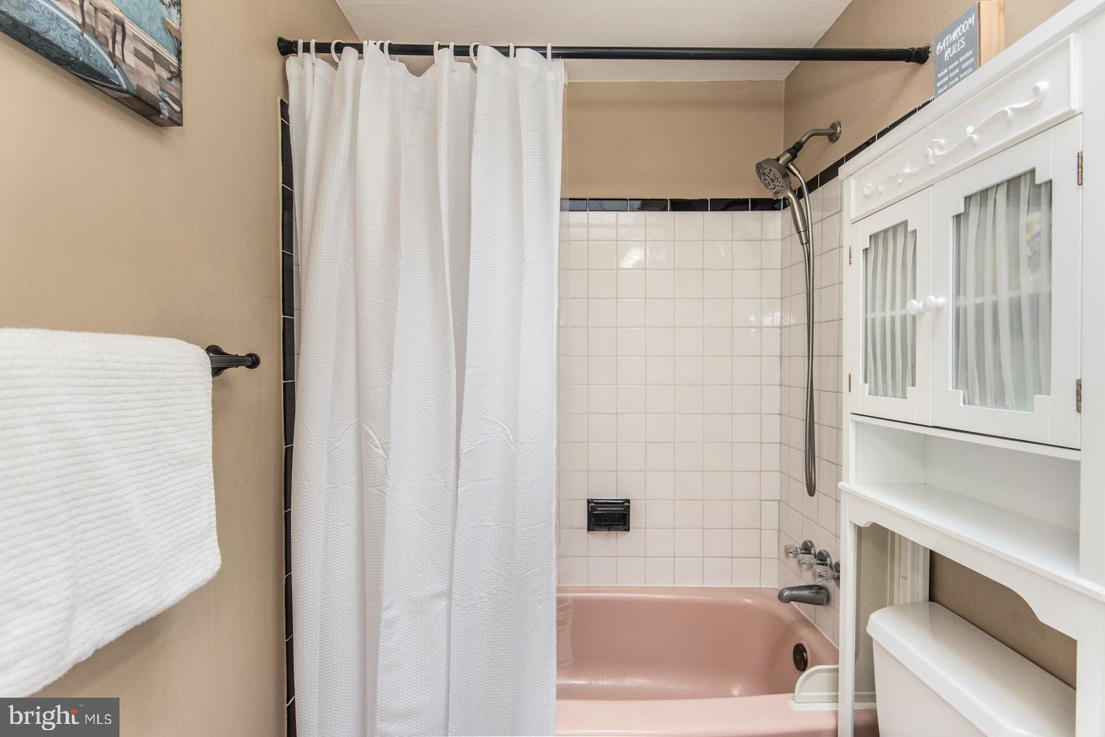 12138 Barbary Road Philadelphia, PA 19154 - Photo 32 of 71 a bathroom with a shower curtain and a bathtub