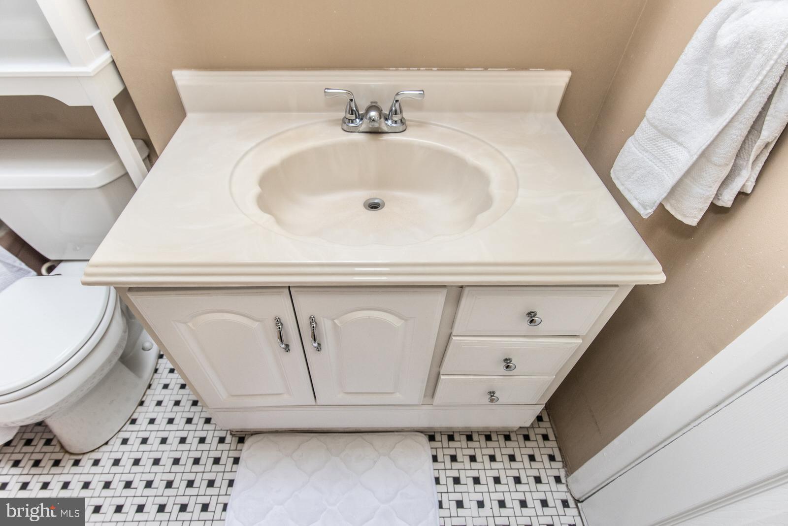 12138 Barbary Road Philadelphia, PA 19154 - Photo 38 of 71 a bathroom with a sink a toilet and a mirror