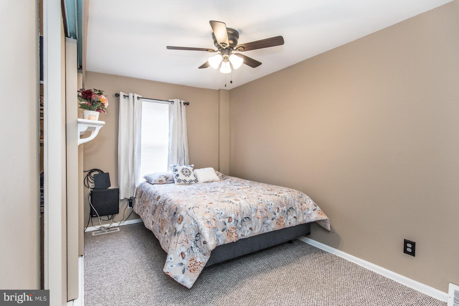 12138 Barbary Road Philadelphia, PA 19154 - Photo 39 of 71 a bedroom with a bed and window