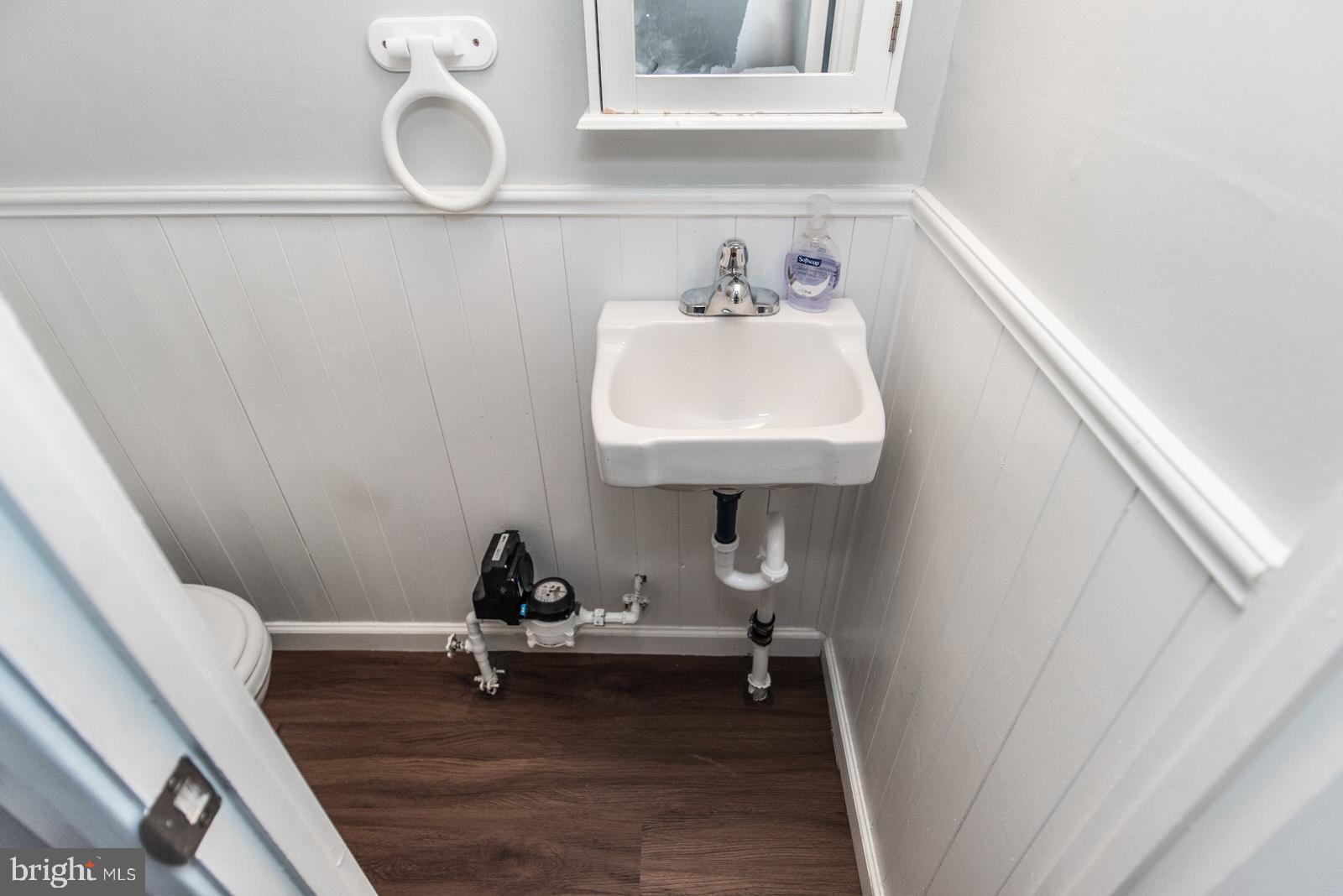 12138 Barbary Road Philadelphia, PA 19154 - Photo 48 of 71 a room with wooden floor and potted plant on a table