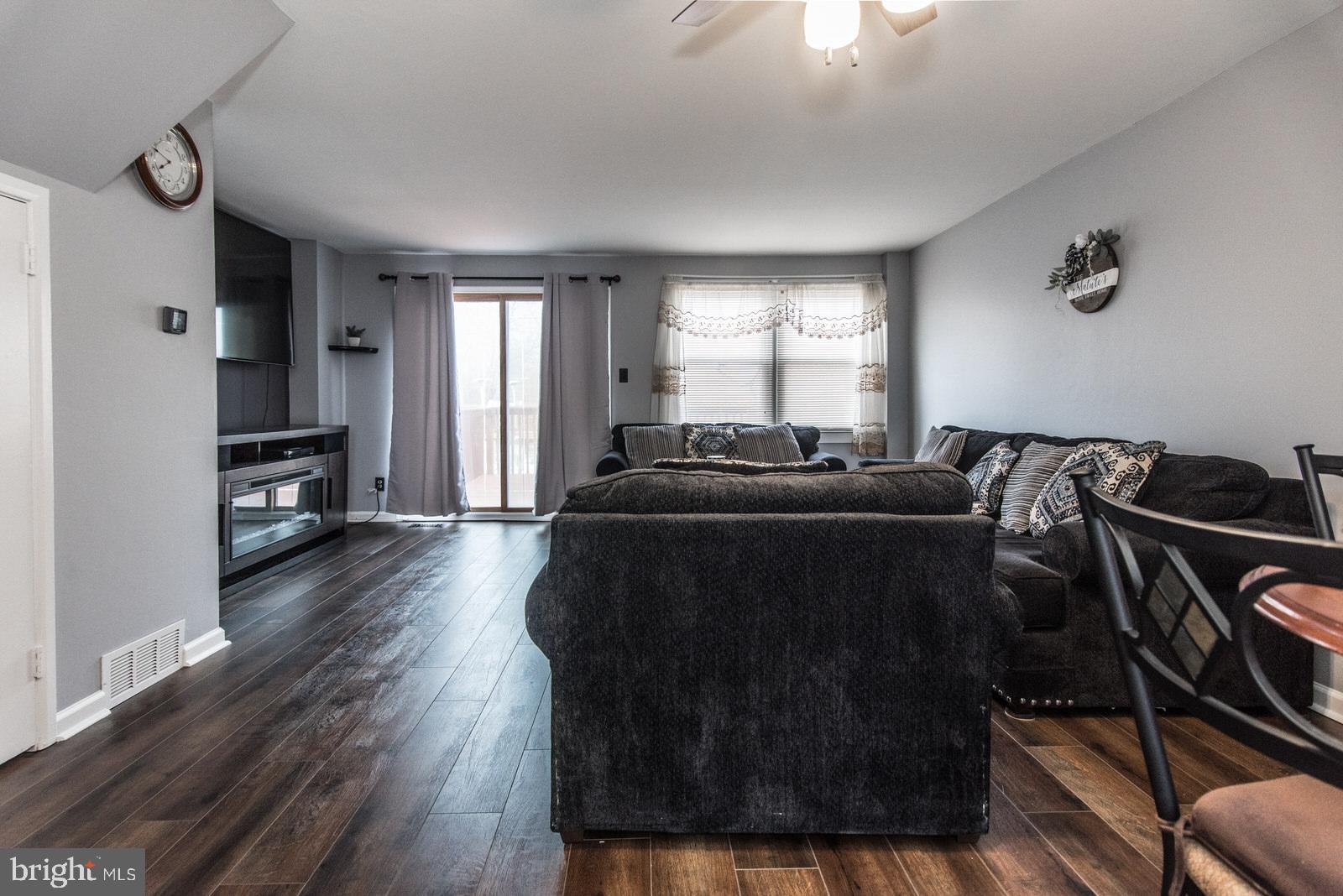 12138 Barbary Road Philadelphia, PA 19154 - Photo 7 of 71 a living room with furniture and a flat screen tv