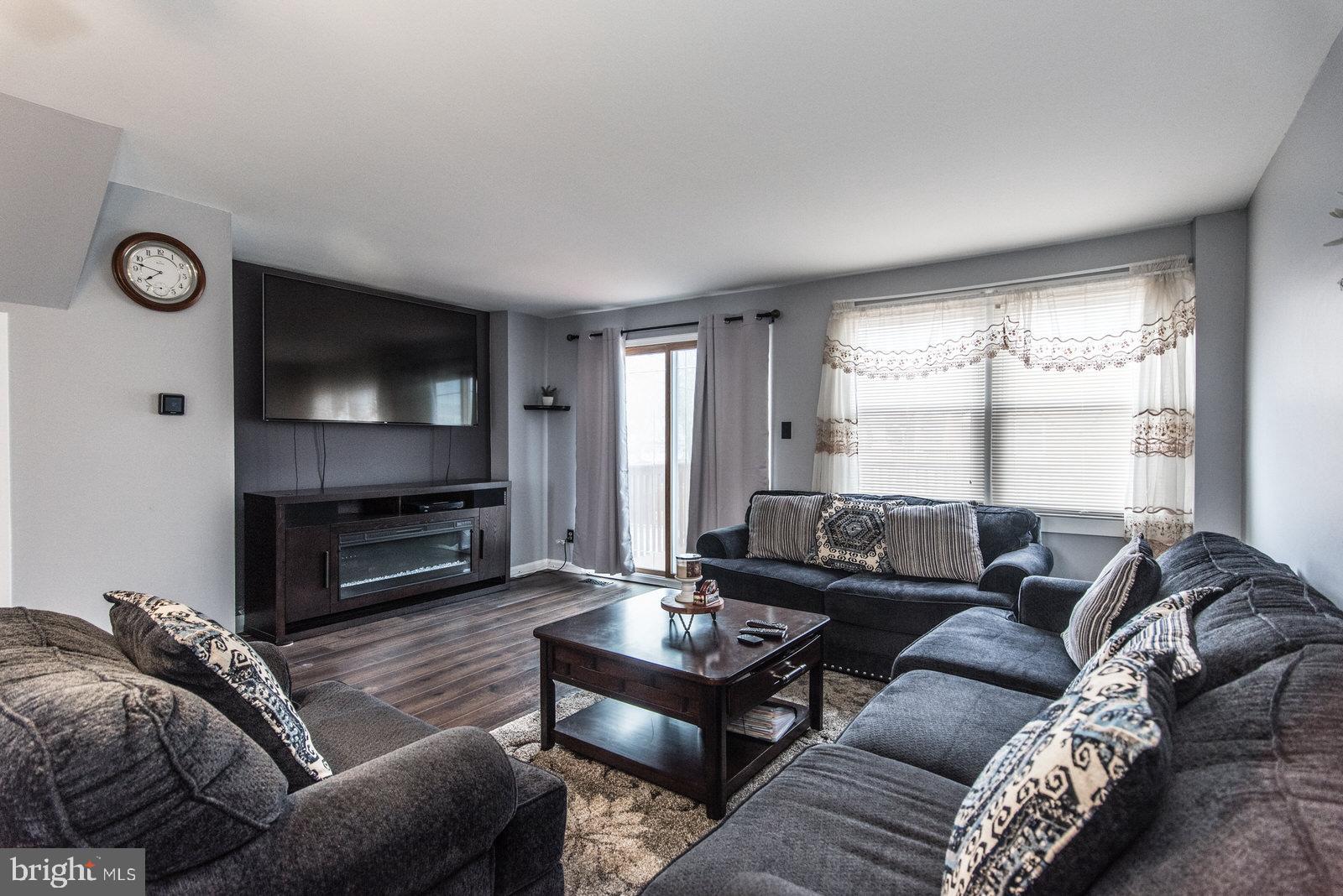 12138 Barbary Road Philadelphia, PA 19154 - Photo 8 of 71 a living room with furniture a window and a flat screen tv