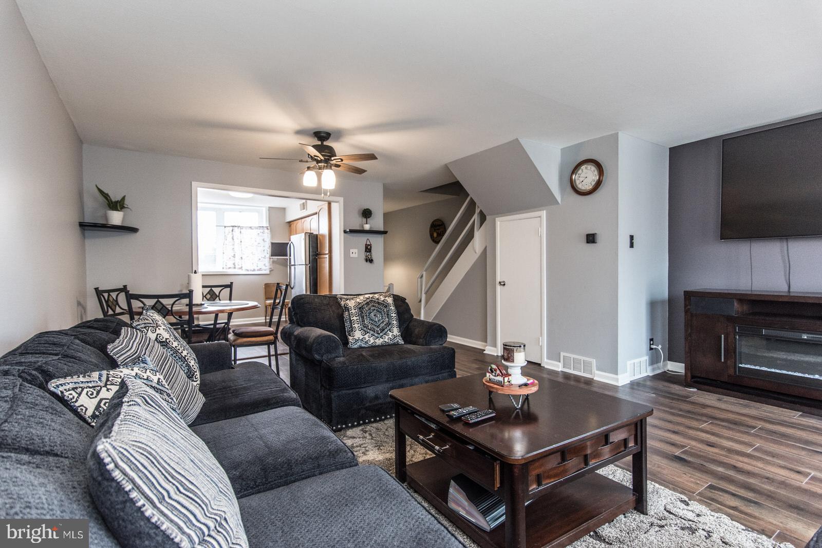 12138 Barbary Road Philadelphia, PA 19154 - Photo 10 of 71 a living room with furniture a flat screen tv and a fireplace