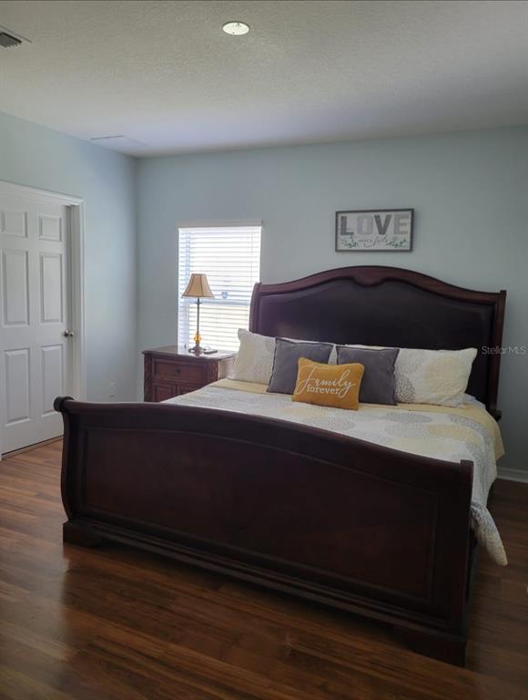 4623 Kalispell Road Kissimmee, FL 34758 - Photo 2 of 6 a bedroom with a bed and window