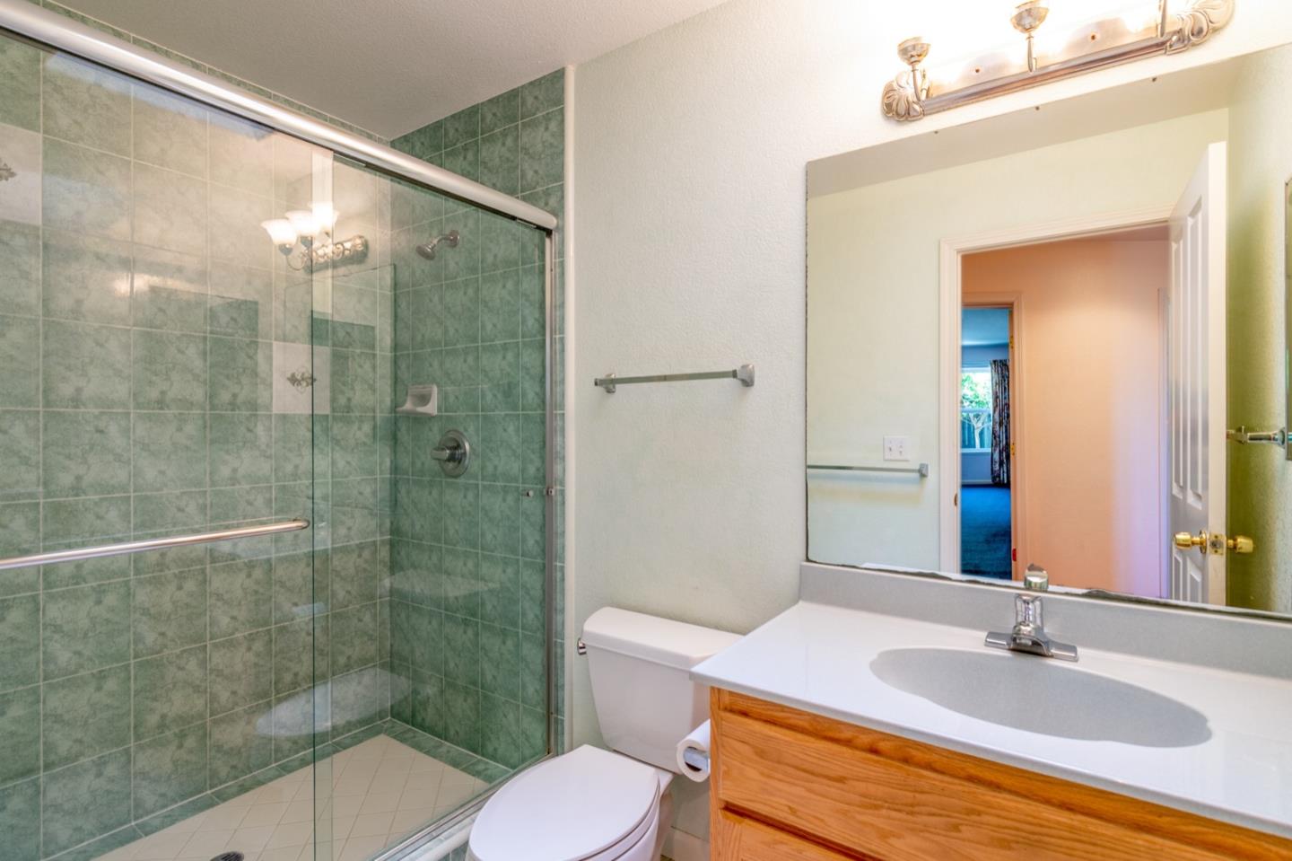 661 Cambrian Drive Campbell, CA 95008 - Photo 16 of 31 a bathroom with a granite countertop sink a toilet and shower