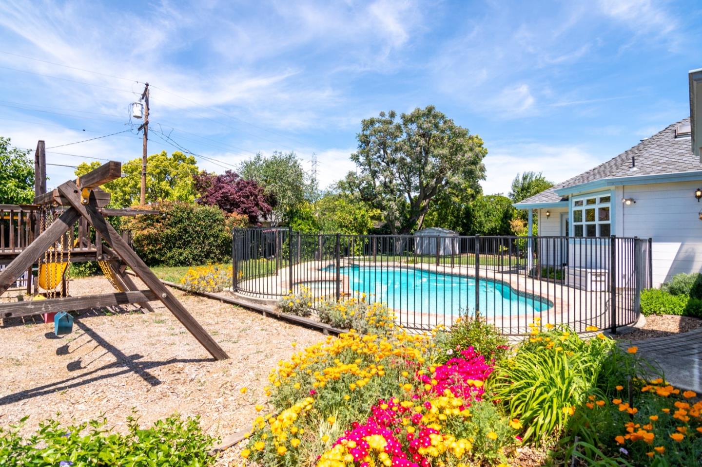 661 Cambrian Drive Campbell, CA 95008 - Photo 26 of 31 a view of a swimming pool with a patio and flower garden