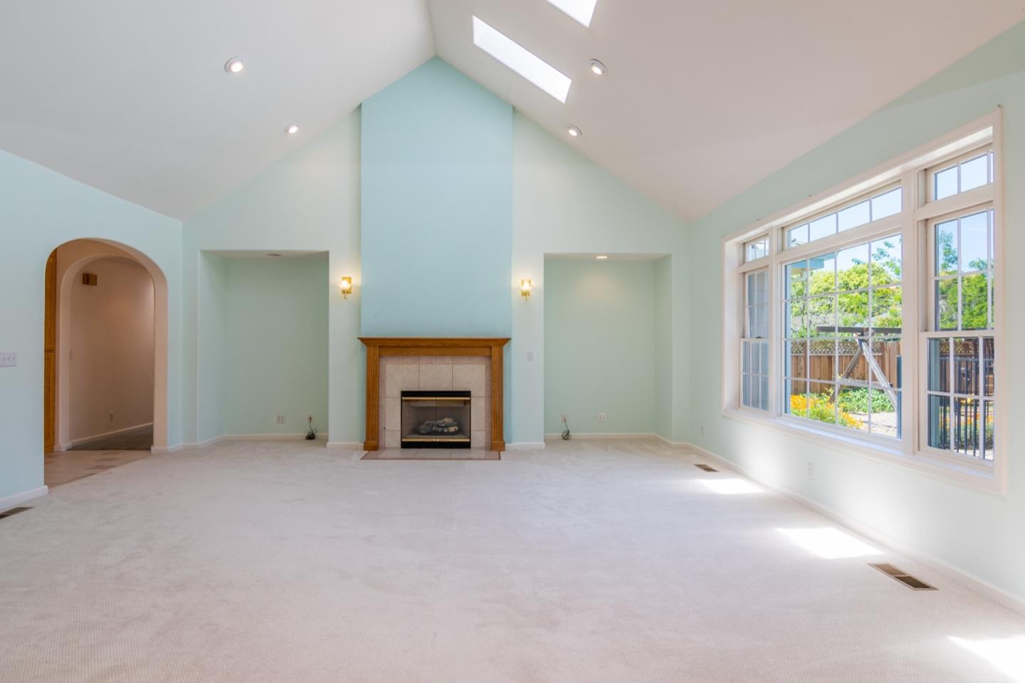 661 Cambrian Drive Campbell, CA 95008 - Photo 6 of 31 an empty room with fireplace and a window