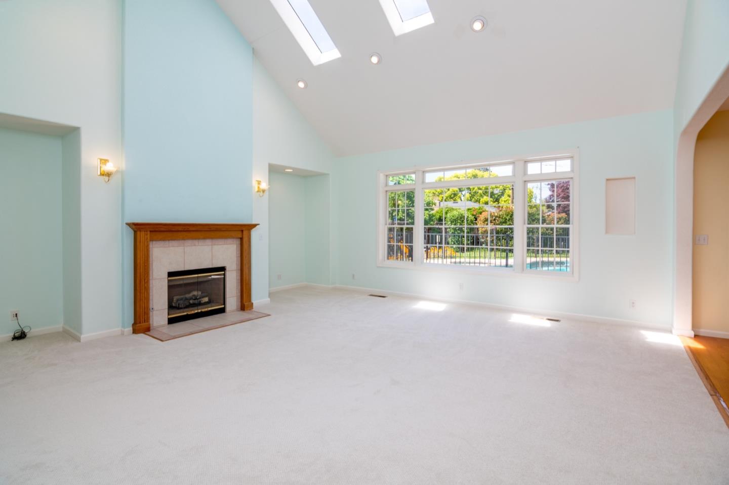 661 Cambrian Drive Campbell, CA 95008 - Photo 7 of 31 a view of a livingroom with a fireplace and window