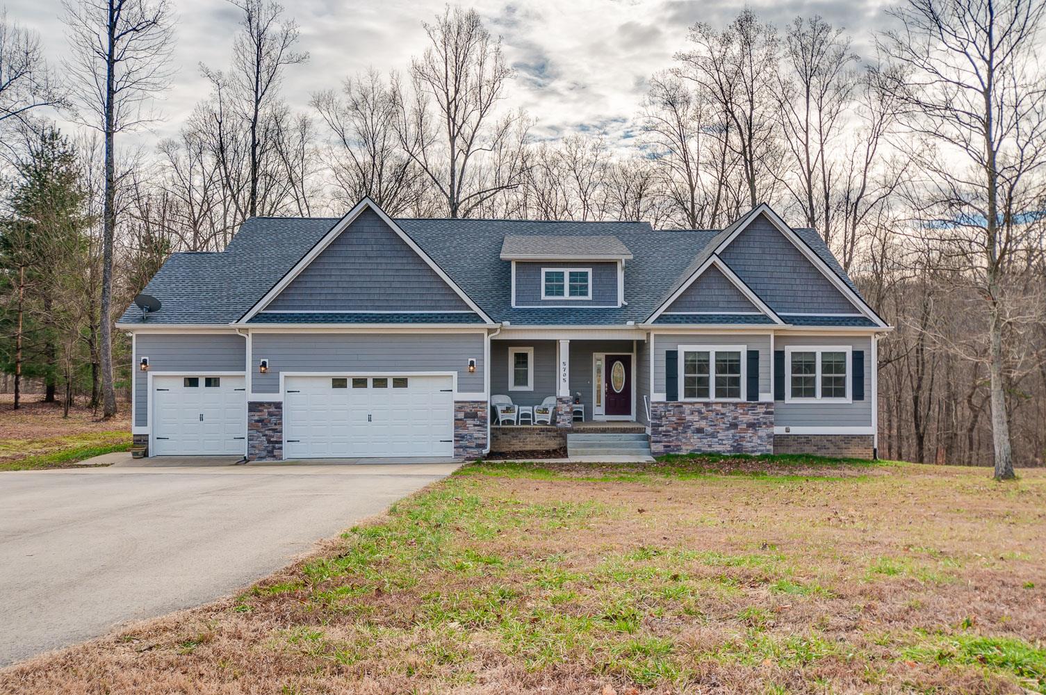 5705 Hopewell Ridge Road Franklin, TN 37064 - Photo 1 of 30 a front view of a house with a yard and large trees