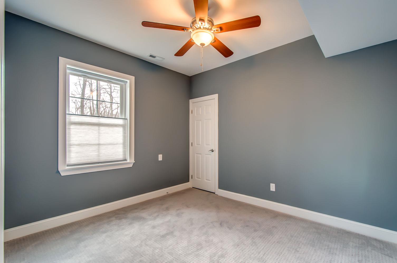 5705 Hopewell Ridge Road Franklin, TN 37064 - Photo 17 of 30 an empty room with windows and fan