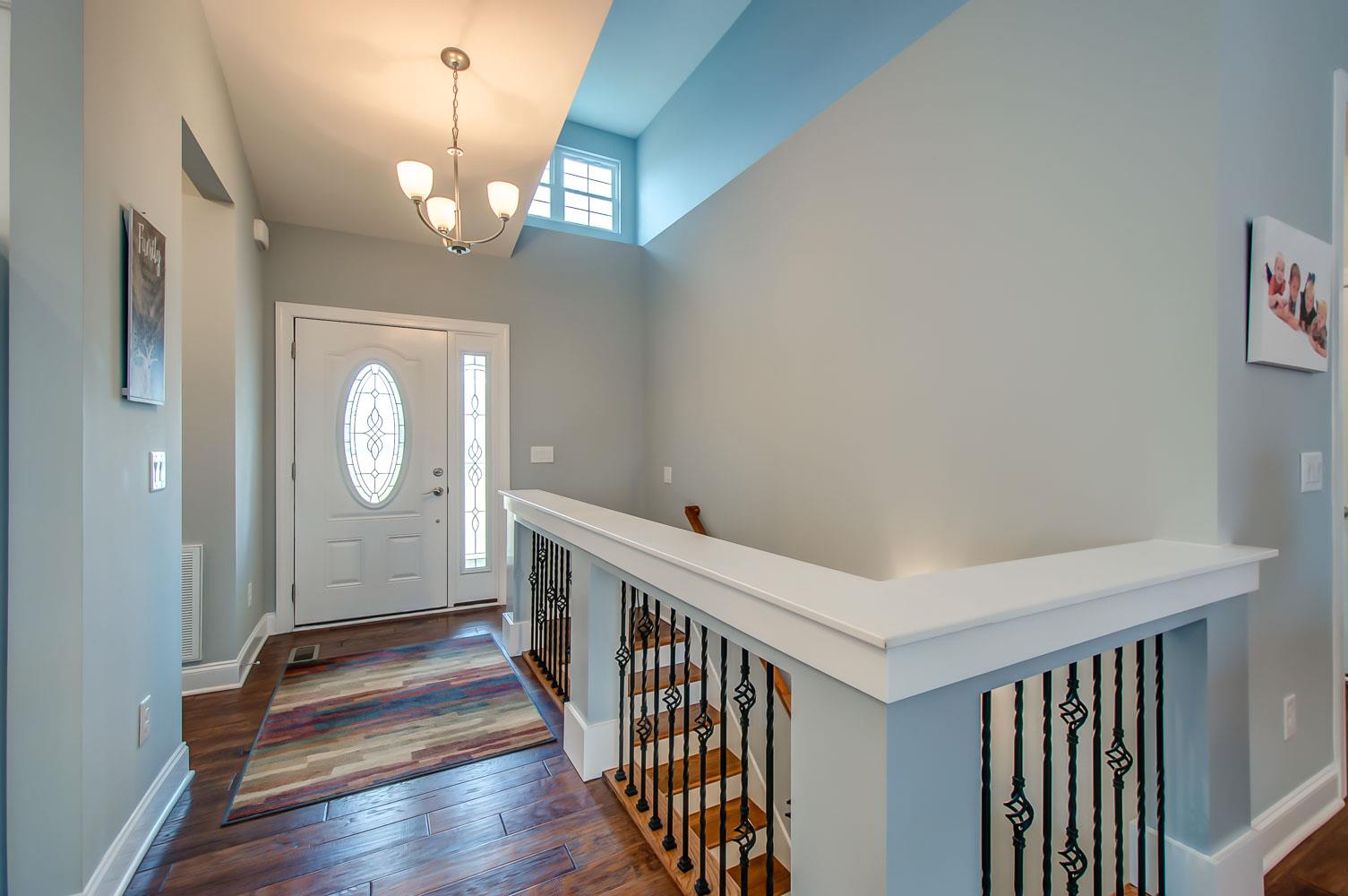 5705 Hopewell Ridge Road Franklin, TN 37064 - Photo 2 of 30 a view of a hallway with wooden floor and stairs