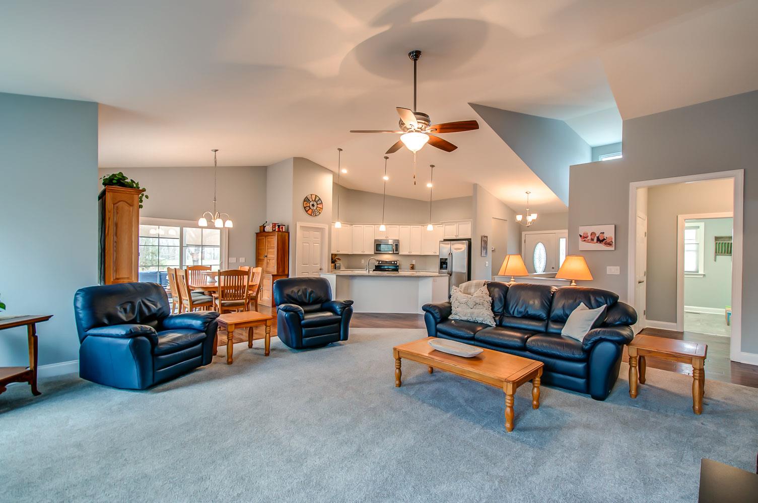 5705 Hopewell Ridge Road Franklin, TN 37064 - Photo 3 of 30 a living room with furniture and a chandelier