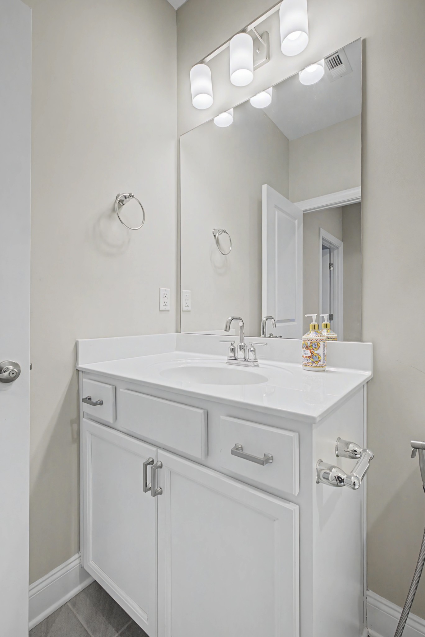 1205 Bridgett Way Mount Juliet, TN 37122 - Photo 22 of 43 a bathroom with a sink a light fixture and a mirror