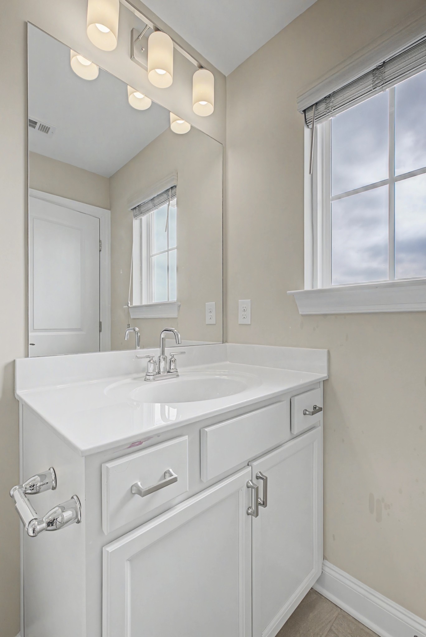 1205 Bridgett Way Mount Juliet, TN 37122 - Photo 33 of 43 a bathroom with a sink a vanity and a mirror