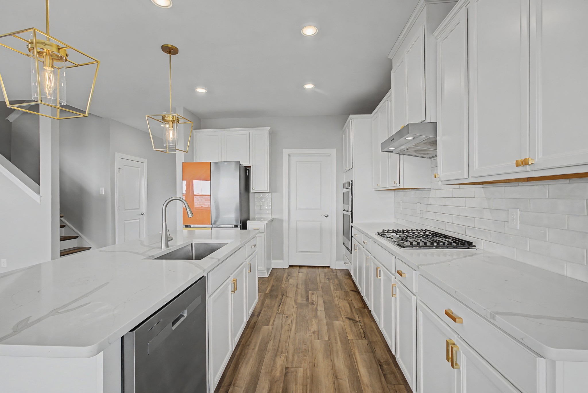 1205 Bridgett Way Mount Juliet, TN 37122 - Photo 10 of 43 a kitchen with white cabinets sink and stainless steel appliances