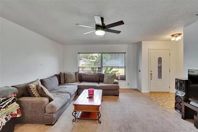 a view of a livingroom with furniture and windows