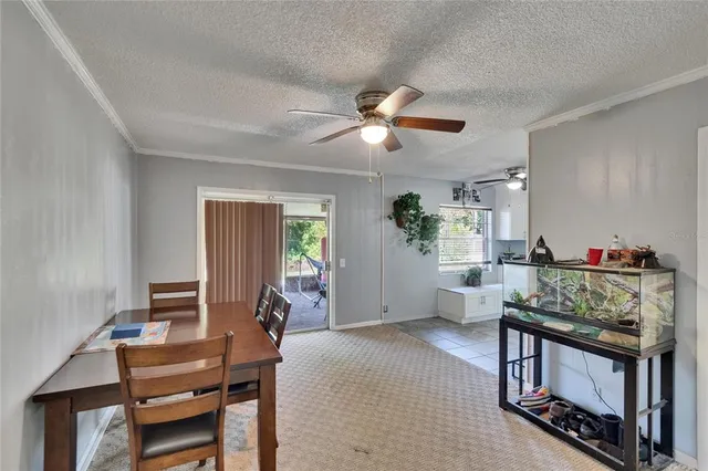 a dining room with furniture and window