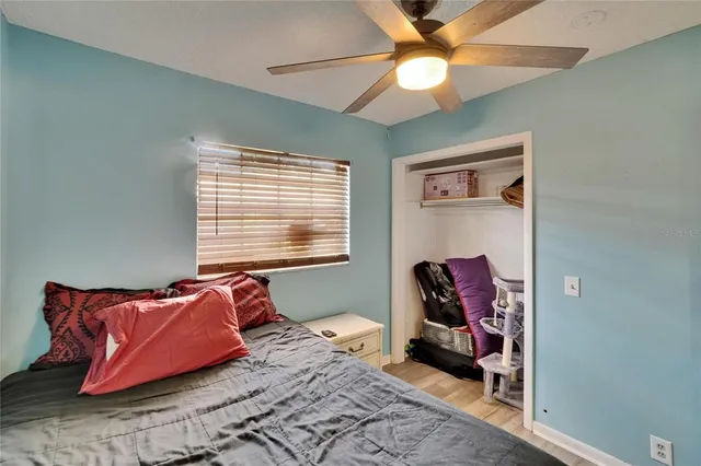 a living room with furniture a air conditioner and a window