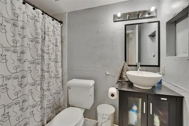 a bathroom with a shower curtain