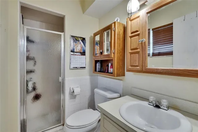 a bedroom with a bed a desk and chair