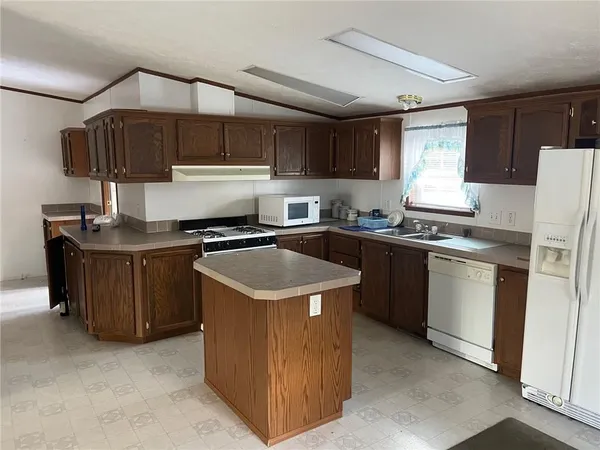 a kitchen that has a sink and a stove