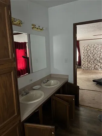 a bathroom with a sink a toilet and bathtub