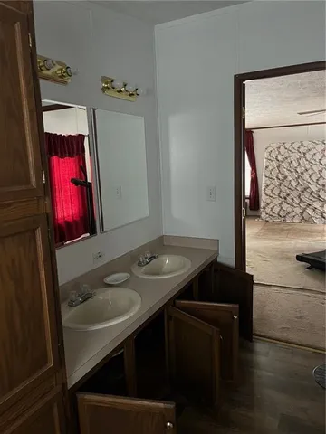 a bathroom with a sink a toilet and bathtub