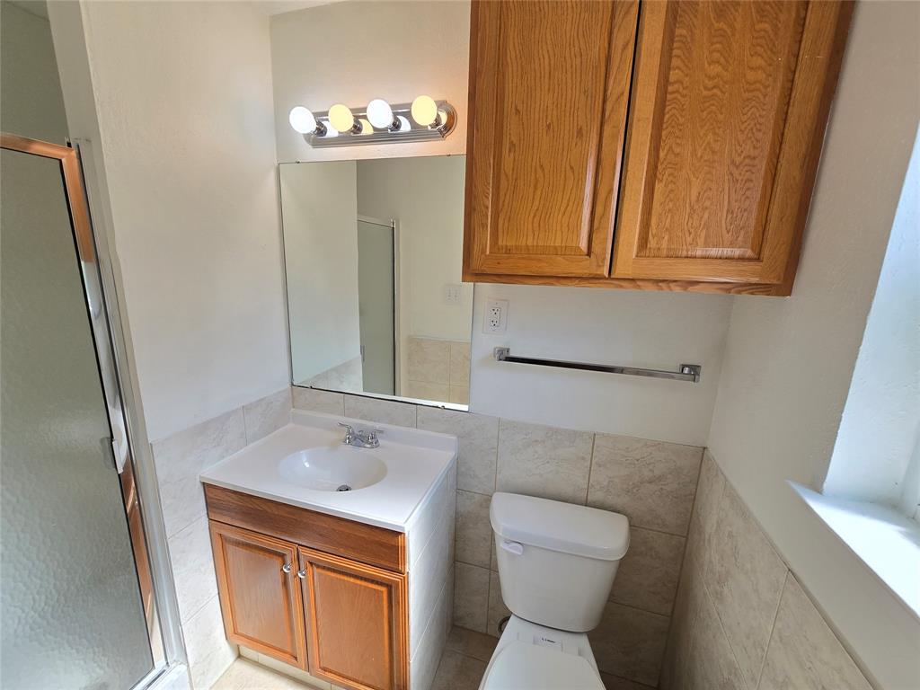 1000 Springdale Road Bedford, TX 76021 - Photo 17 of 36 Main bathroom has a storage vanity.
