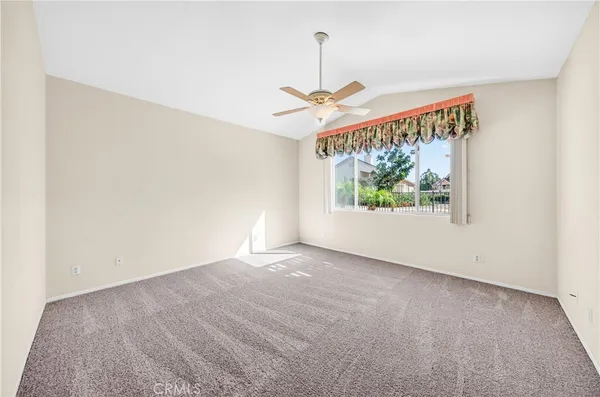 an empty room with windows and outdoor view