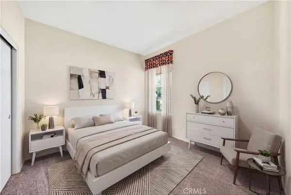 a bedroom with a bed and a dresser